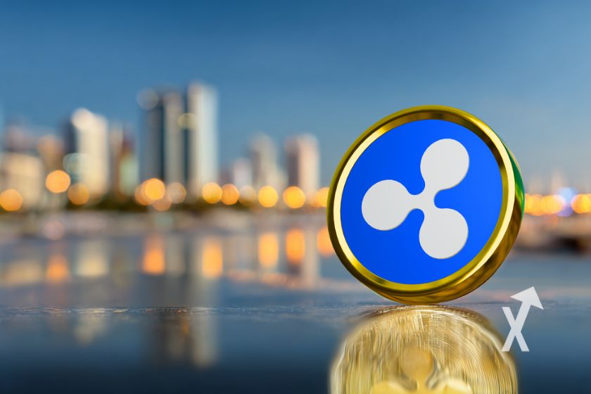XRP Jeton vor Abu Dhabi Skyline.