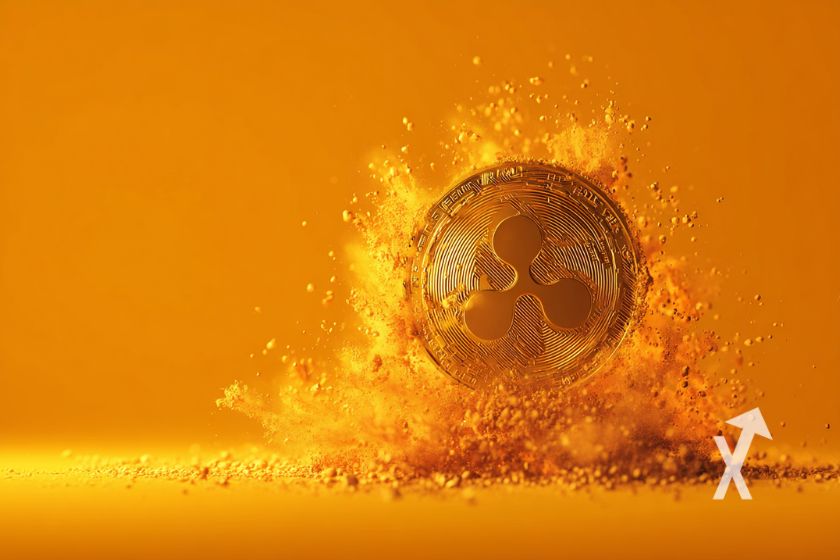 XRP-M&uuml;nze auf orangem Hintergrund. Explosion.