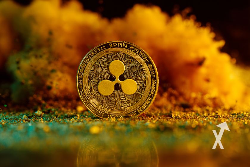 xrp coin avec de la fum&eacute;e orange sur un fond noir et vert