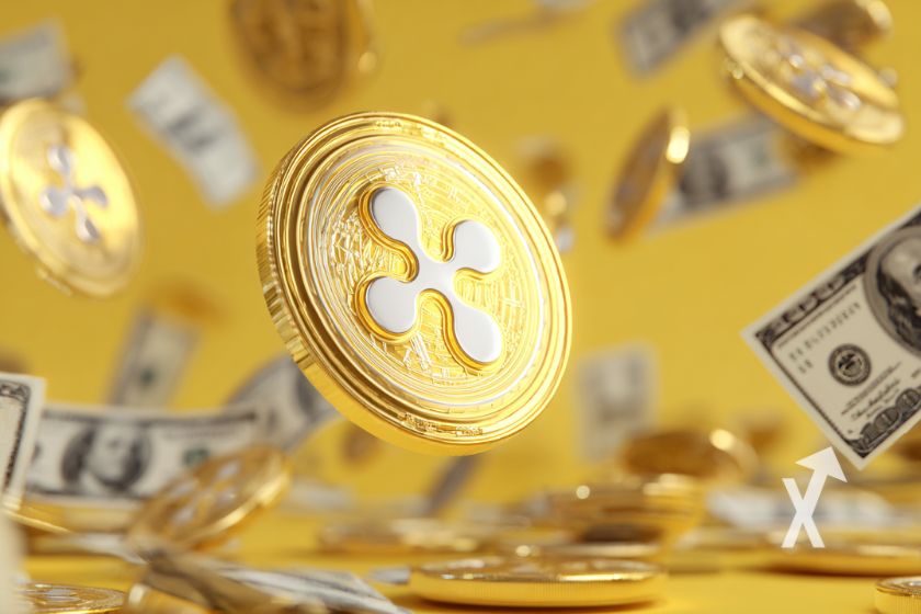 "XRP logo in yellow with flying dollars"