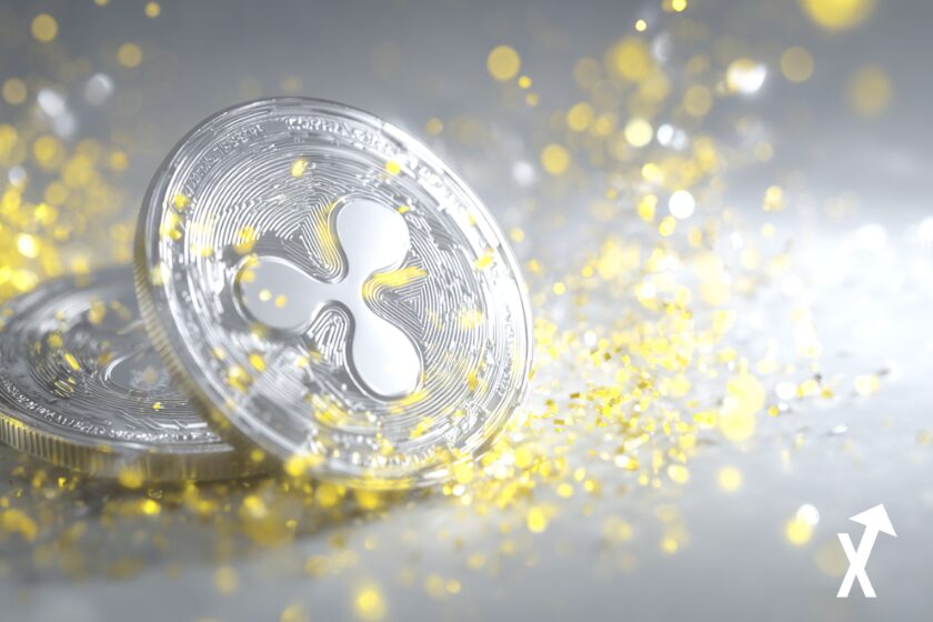 "Silver XRP coin on shiny silver and gold background"