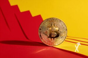 coin Bitcoin sur un fond jaune et rouge