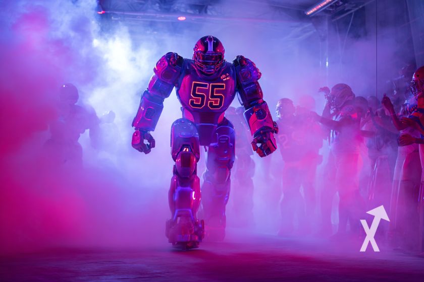 Robots avec un equipement NFL dans un fond de fum&eacute;e rose