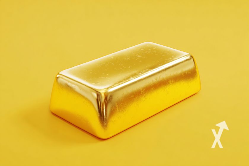 Lingote de oro sobre fondo amarillo.