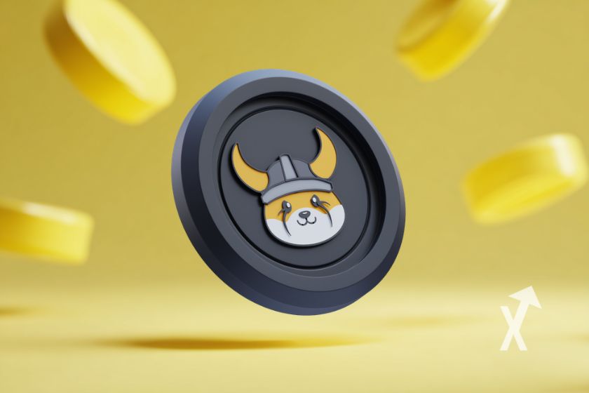 Criptomoneda FLOKI rodeada de monedas amarillas.