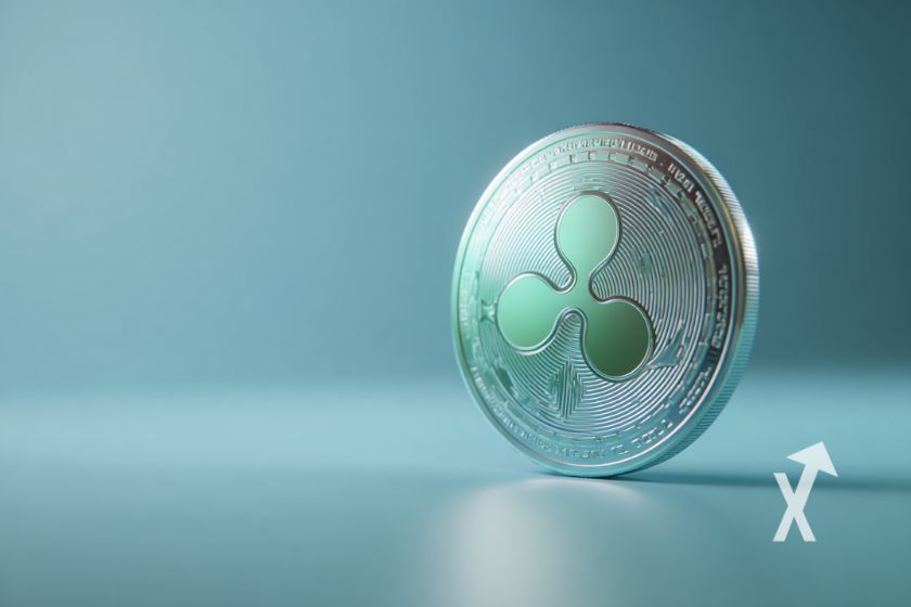 Moneda XRP azul en fondo verde.