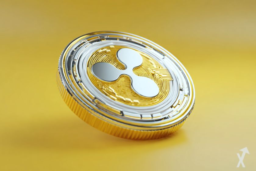 Moneda criptográfica XRP en plata/dorado.