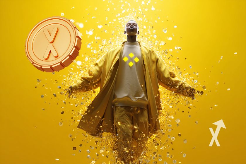 Homme en costume jaune sur un fond jaune qui regarde le ciel avec un coin XRP &agrave; gauche qui vole