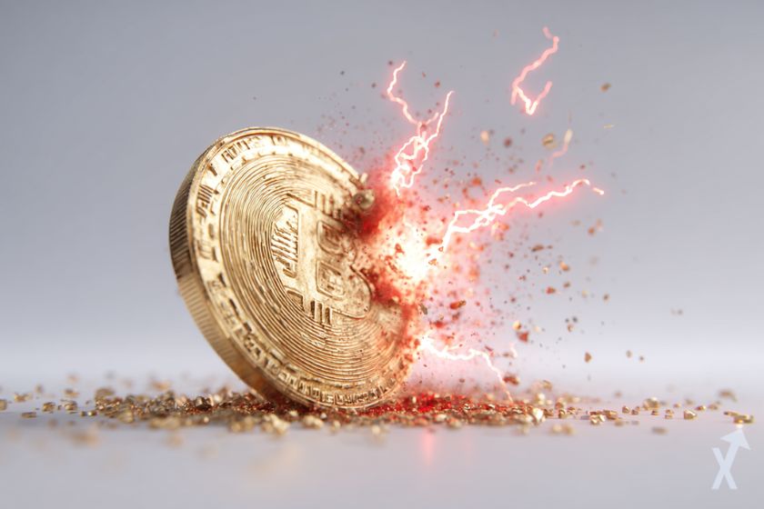 moeda bitcoin dourada sendo atingida por raios vermelhos em fundo cinza