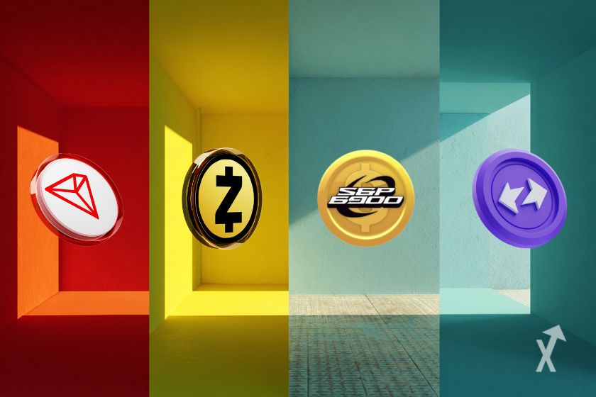 Quatro tokens de cripto alinhados fundo Quatro cores diferentes.