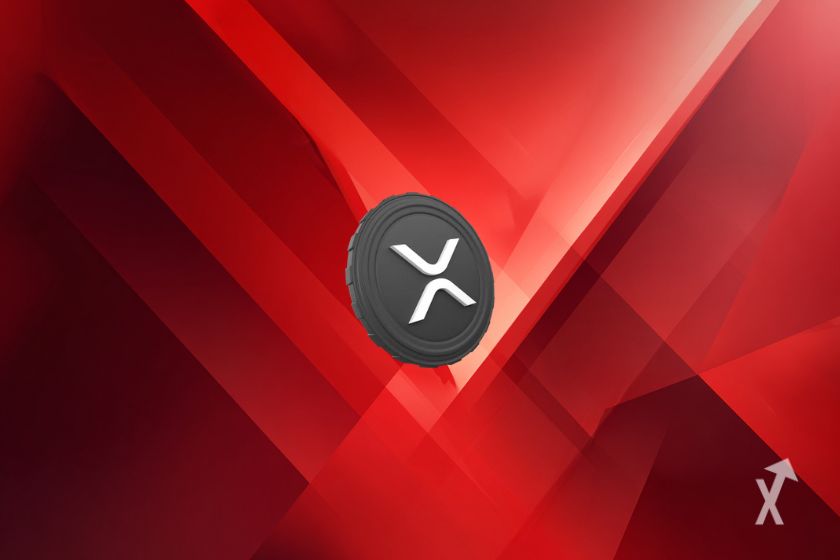 O token XRP cinzento sobre fundo vermelho.