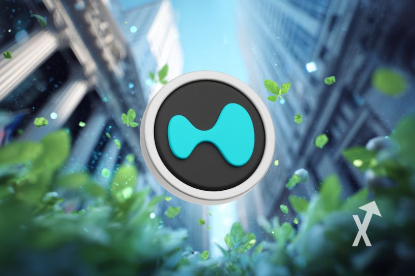 coin HYPE de Hyperliquid sur un fon de rue de Wall Street avec bâtiments et des plantes autour du coin