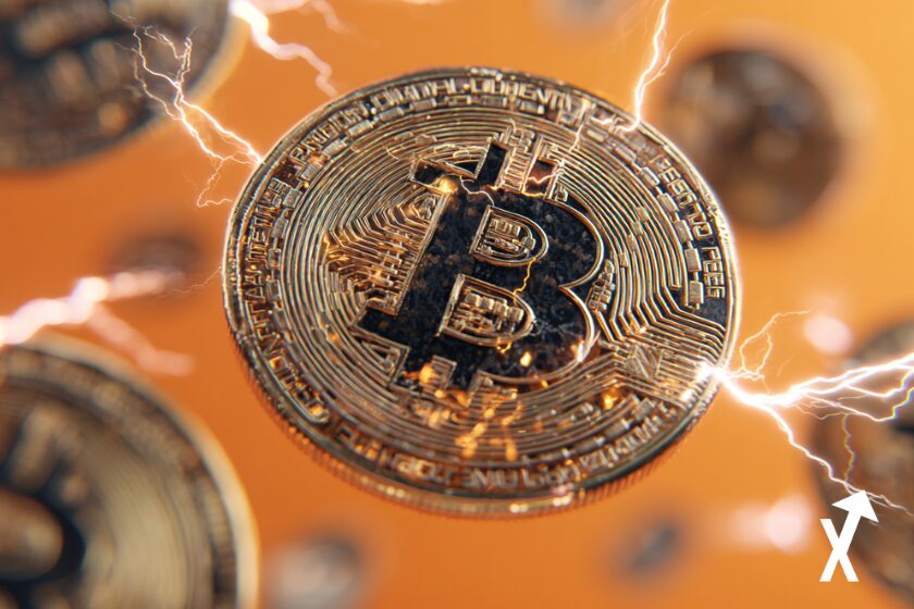 bitcoin coin doré sur fond orange electrique