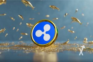 coin xrp sur un fond bleu avec petites baleines et en or