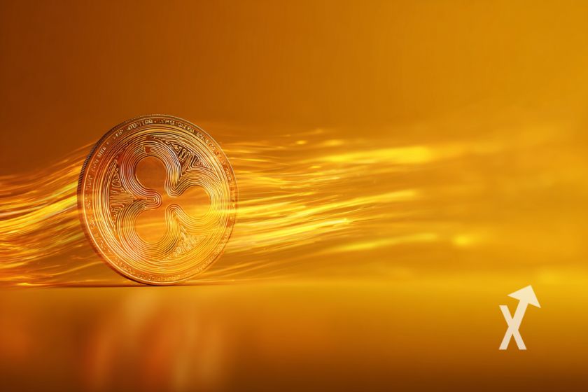 coin xrp en orange sur un fond orange avec lignes de lumières jaunes